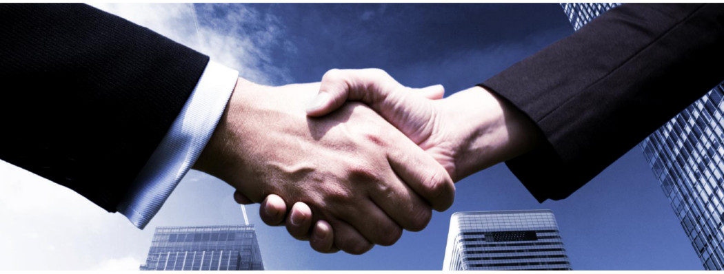 Two Men Shaking Hands After Agreeing On Exporting Services at Stile International